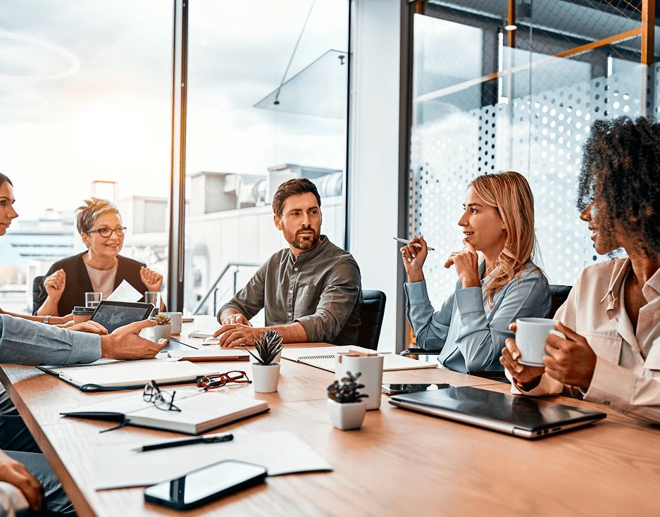 GettyImages-2149849641 Team meeting in modern office setting.