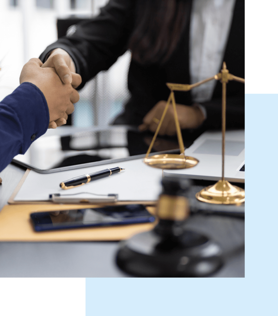 h1 02 Handshake over legal documents and scales.